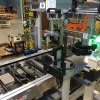 This D-Clutch Gage Machine verifies the operator assembled the clutch stack correctly in the nest using a vision system. The operator shuttles the D-Clutch Stack into the gage position and a pneumatic cylinder lowers the LVDT onto the clutch stack to determine the thickness. Operator then uses the install tool(hanging above the clutch stack) to load it into the Transmission case.